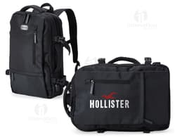 Homem de negócios usando um elegante terno preto, segurando uma mochila de nylon preta de 20 litros com USB. O acessório tem