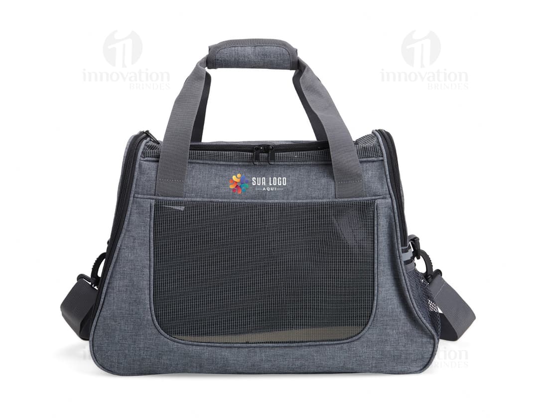 Bolsa em oxford para pets com bolso lateral, em cor marrom e fecho de zipper. Perfeita para transportar de forma segura e