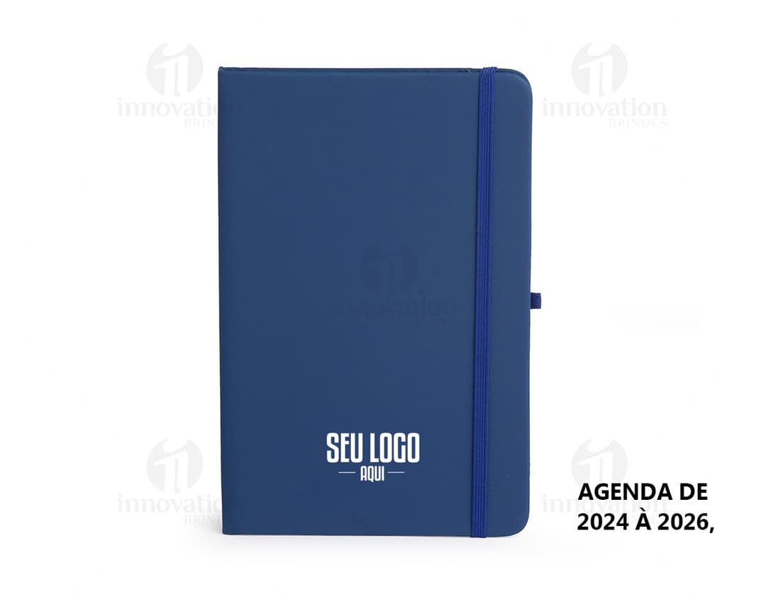 Planner Emborrachado Anual em design moderno e 3D, com espaço para armazenamento de dados digitais em notebook e videodisk.