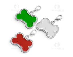 Chaveiro em formato de osso em cor prata com detalhes de patinhas.