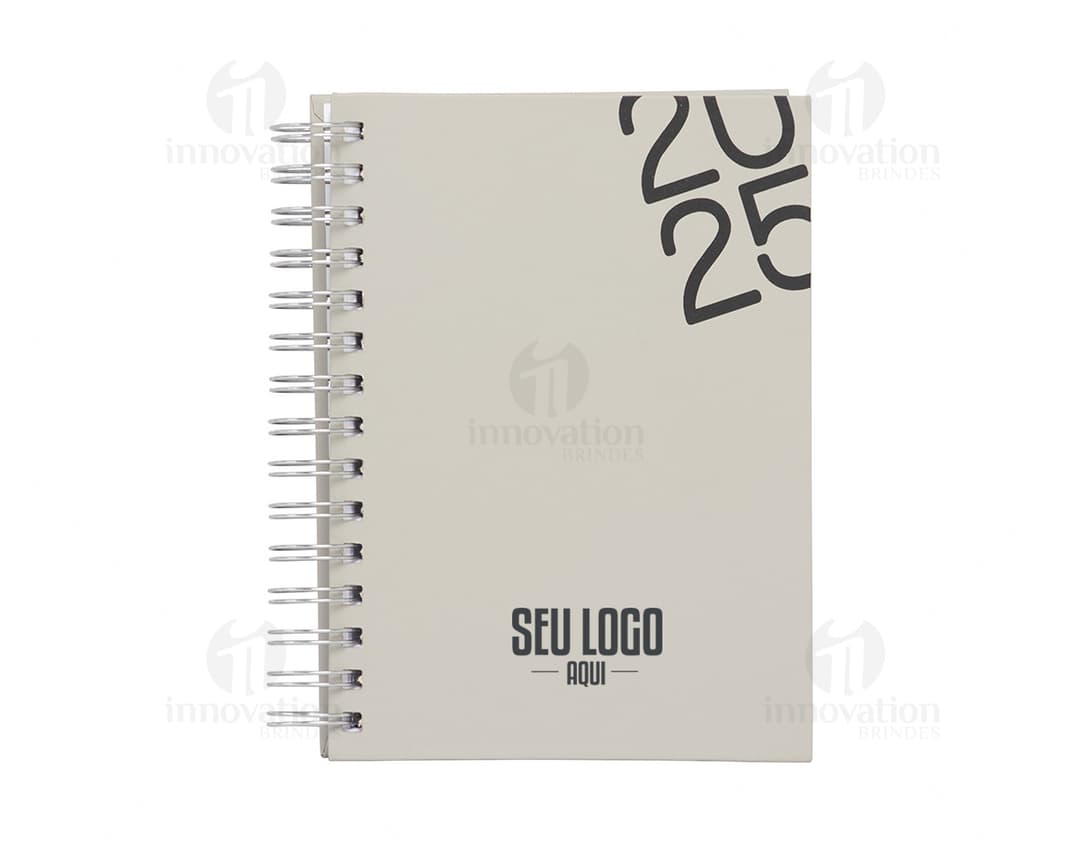 Agenda diária 2025 Wire-o com capa dura na cor preta e detalhes em dourado, apresentando páginas internas decoradas com
