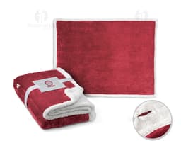 Manta polar 190 g/m² em embalagem de papelão marrom vazia, aberta, com laço de fita.