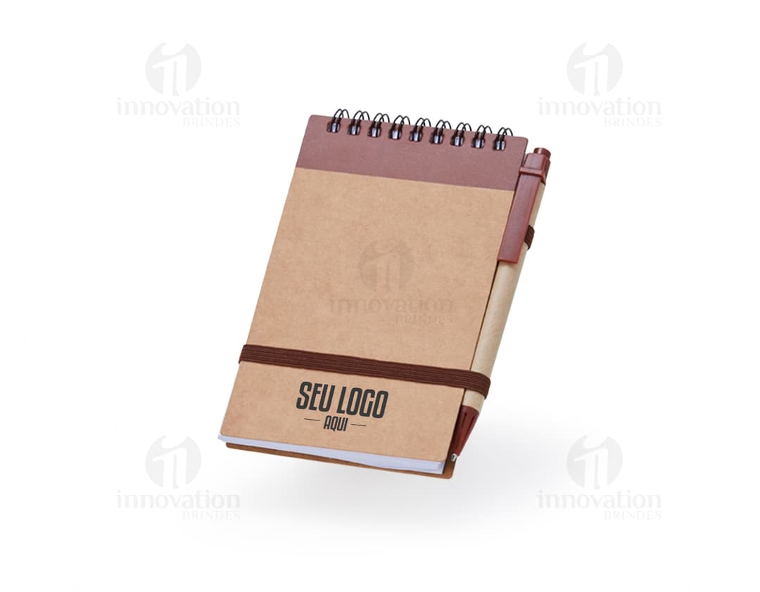 Bloco de anotações de 14x9 cm, feito de material isolante e de construção, em papel marrom. Vazio, com espaço para escrever e