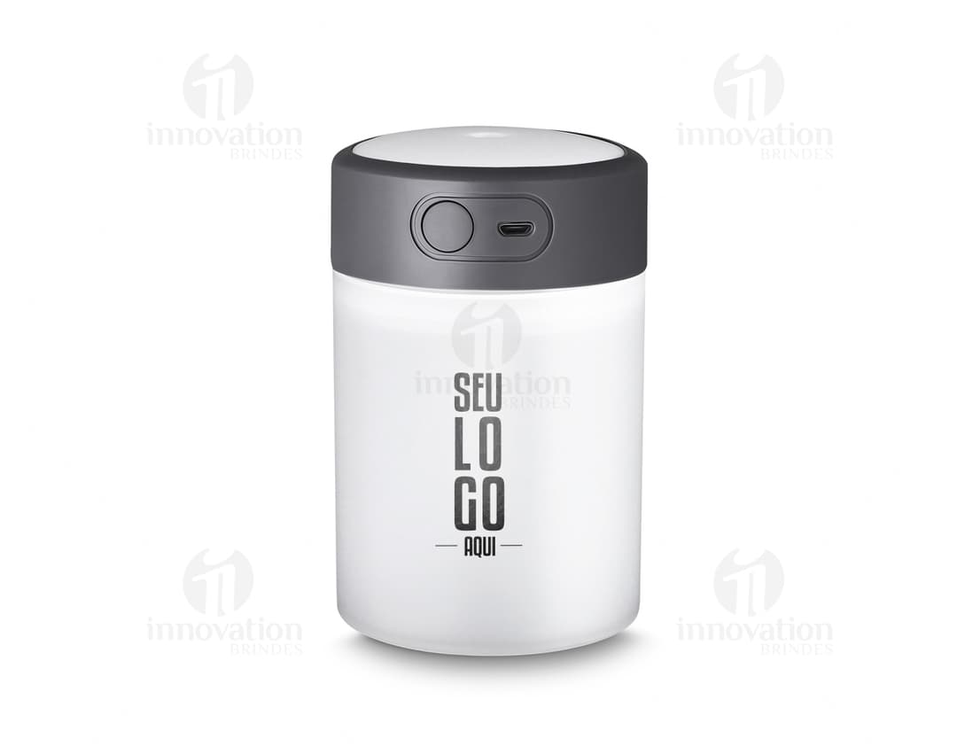 Umidificador de ar c/ difusor USB em embalagem de plástico transparente, com tampa colorida em metal. Objeto de metal em