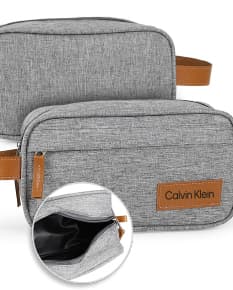 Necessaire de poliéster com detalhes em couro sintético, moderna e elegante. Compartimento único, fecho de correr, estilo