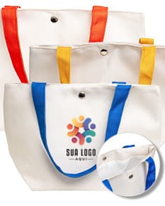 Bolsa de lona na cor azul-marinho com alças de couro marrom e fecho de zíper na parte superior.