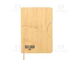 Caderneta com suporte para celular em cor rosa com elástico para prender o celular na capa frontal.