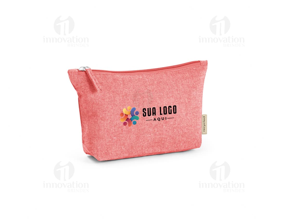 Bolsa de algodão em cor bege, com alças curtas e detalhes em marrom. Possui um bolso frontal com zíper e estampa floral